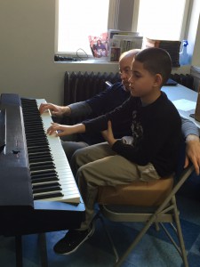 Manuel learning piano at Graffiti 2